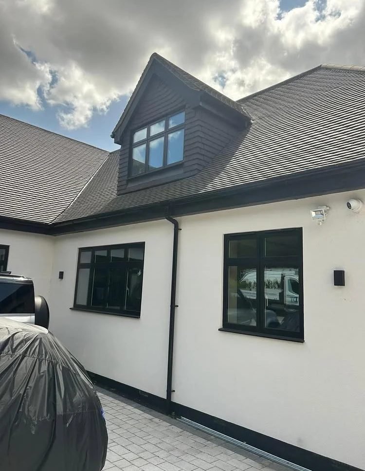 Black slate cladding with new guttering